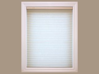 Cordless Blinds and Shades | Motorized Shade Experts Radiance Cordless Driftwood Roman Shade installed on a window, highlighting the natural texture and modern elegance.